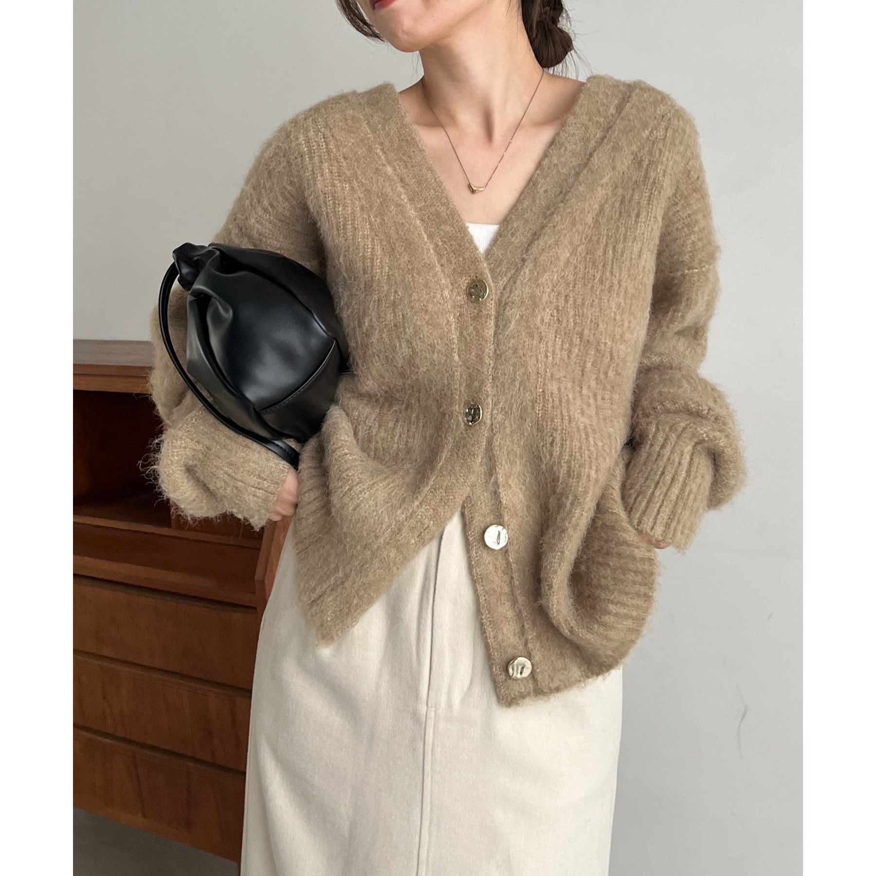 ニュアンスボタンレイヤード風カーディガン