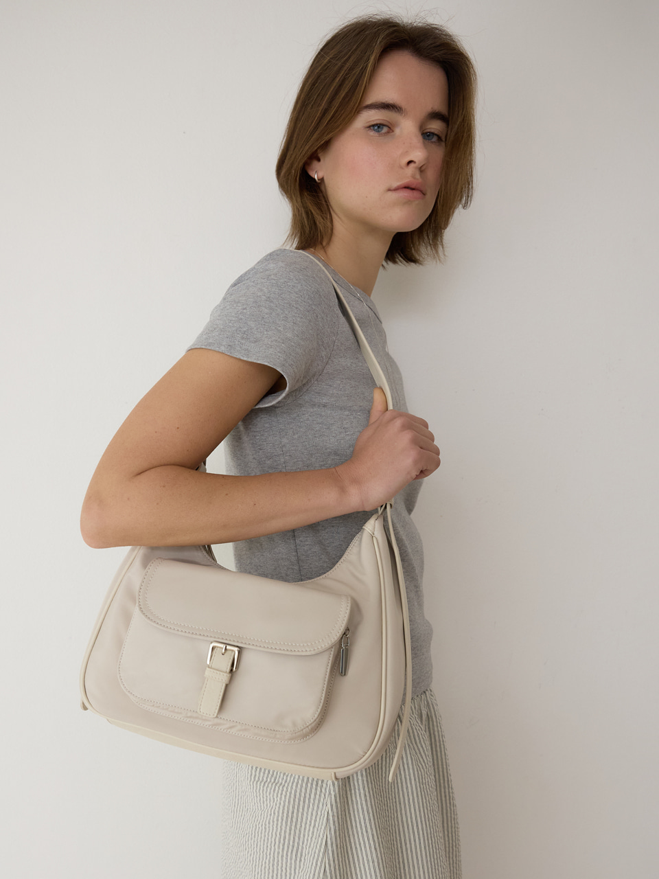 A NYLON BUCKLED POCKET SHOULDER BAG_CREAM