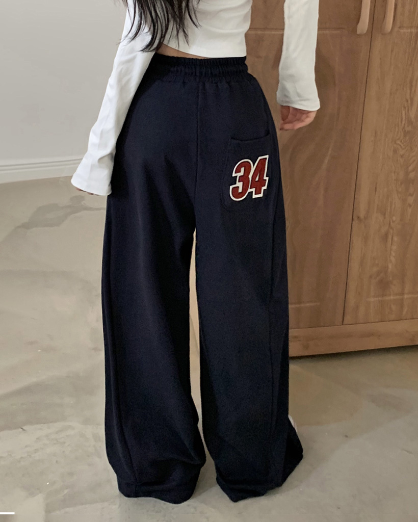 ロゴパッチサイドタック入りワイドトレニンーグパンツ